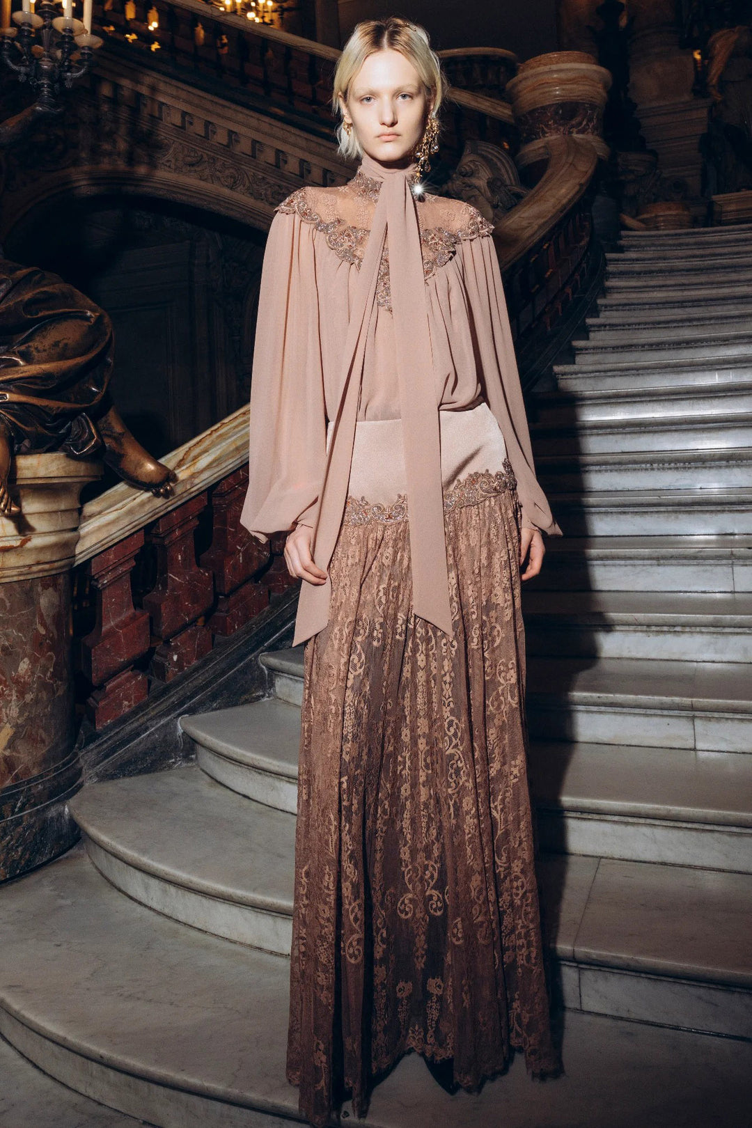 Brown Yvonne Long Lace Skirt with flared silhouette and lace details, front view on model.