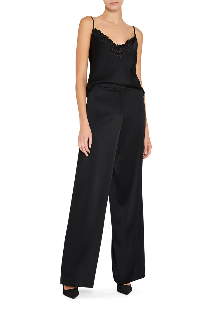 Sleeveless cami silhouette with hand-embroidery, lightweight fabric. Front view on white.