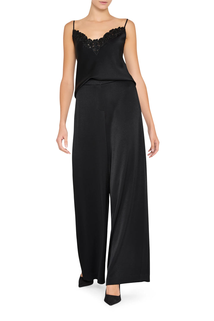 Sleeveless cami with relaxed silhouette and thin straps, soft drape fabric. Front view on white.