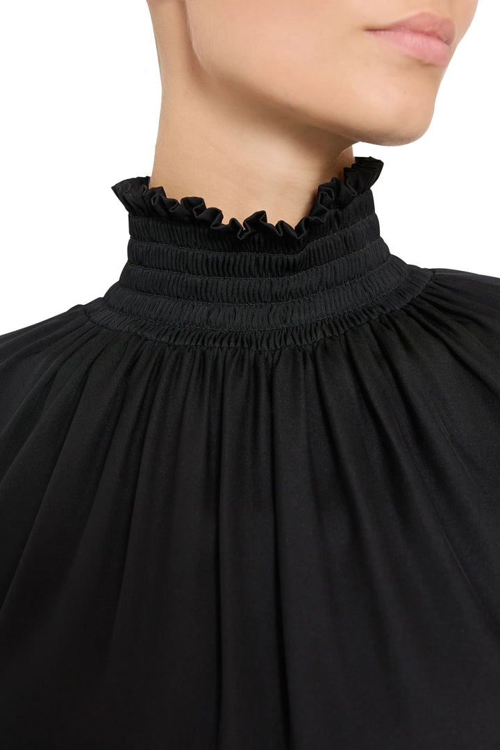 Maxine Silk High Neck Blouse with smocked ruffled neck and dramatic elastic cuff sleeves, front view on model.