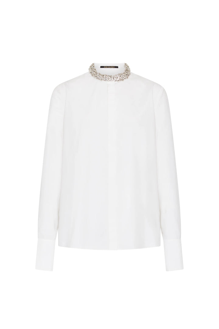 Cotton blouse with crystal-embellished high collar, concealed placket, buttoned cuffs. Front view on white.