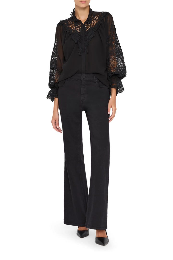 Sheer lace blouse with hand-embroidered details, high neck, bishop sleeves. Front view on white.
