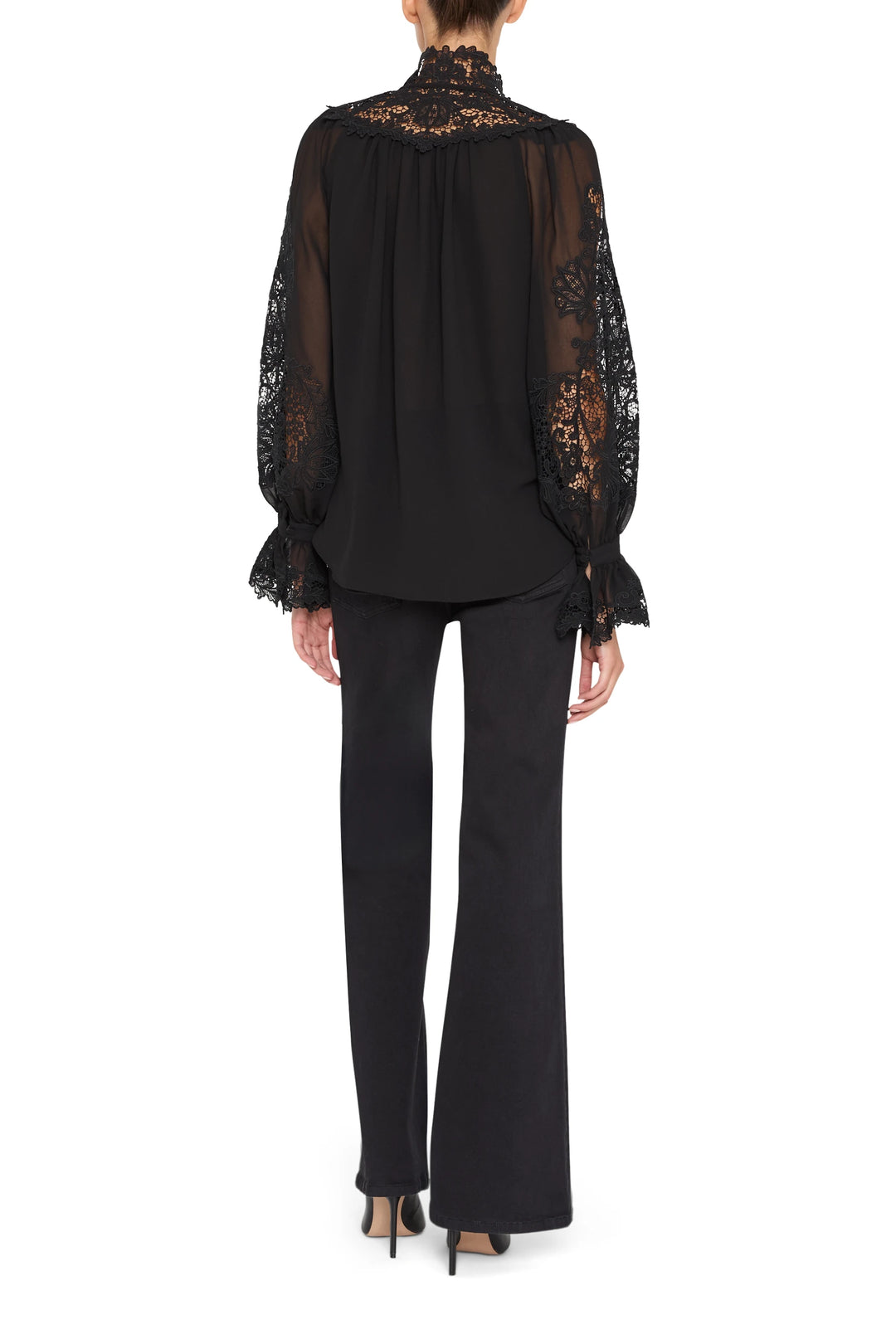Sheer blouse with lace embroidery, relaxed fit, scalloped hem and cuffs. Back view on white.