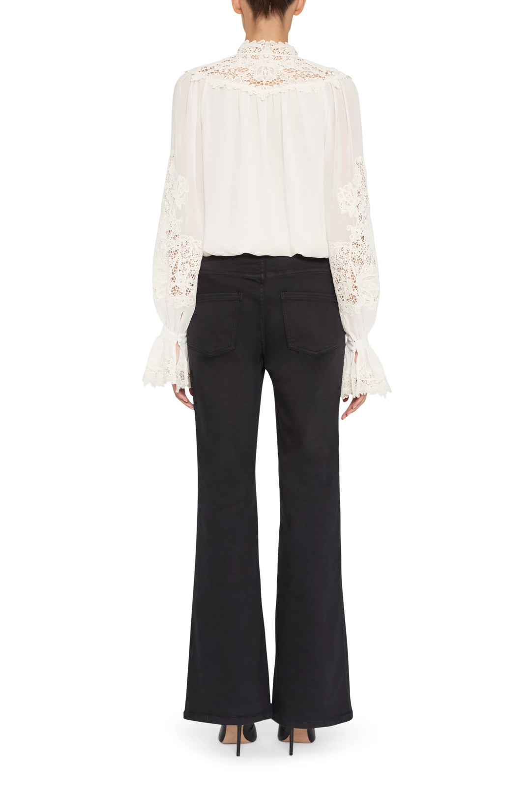 Loose-fit blouse with lace embroidery, gathered yoke, long sleeves; back view on model.