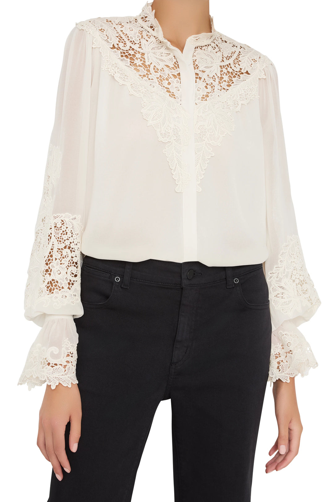 Antique-inspired white blouse with long sleeves, lace embroidery, relaxed fit; front view on model.