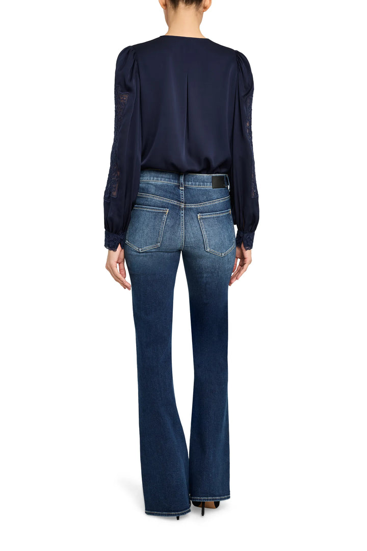 Silk blouse with lace paneling, relaxed fit, long sleeves, back keyhole closure; back view on model.