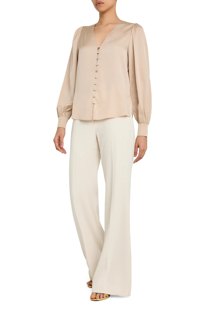 V-neck button down blouse with a relaxed fit and long sleeves, front view on model.