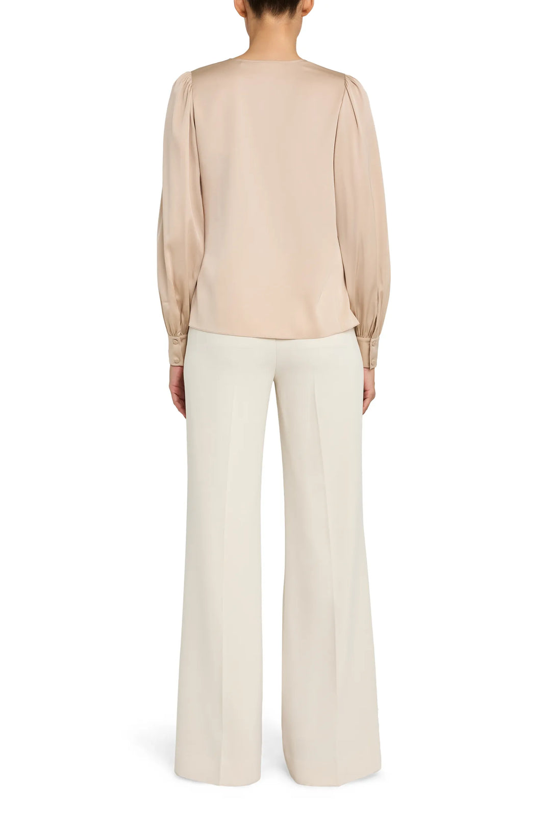 Relaxed silhouette blouse with V neckline and button front, long sleeves; back view on model.
