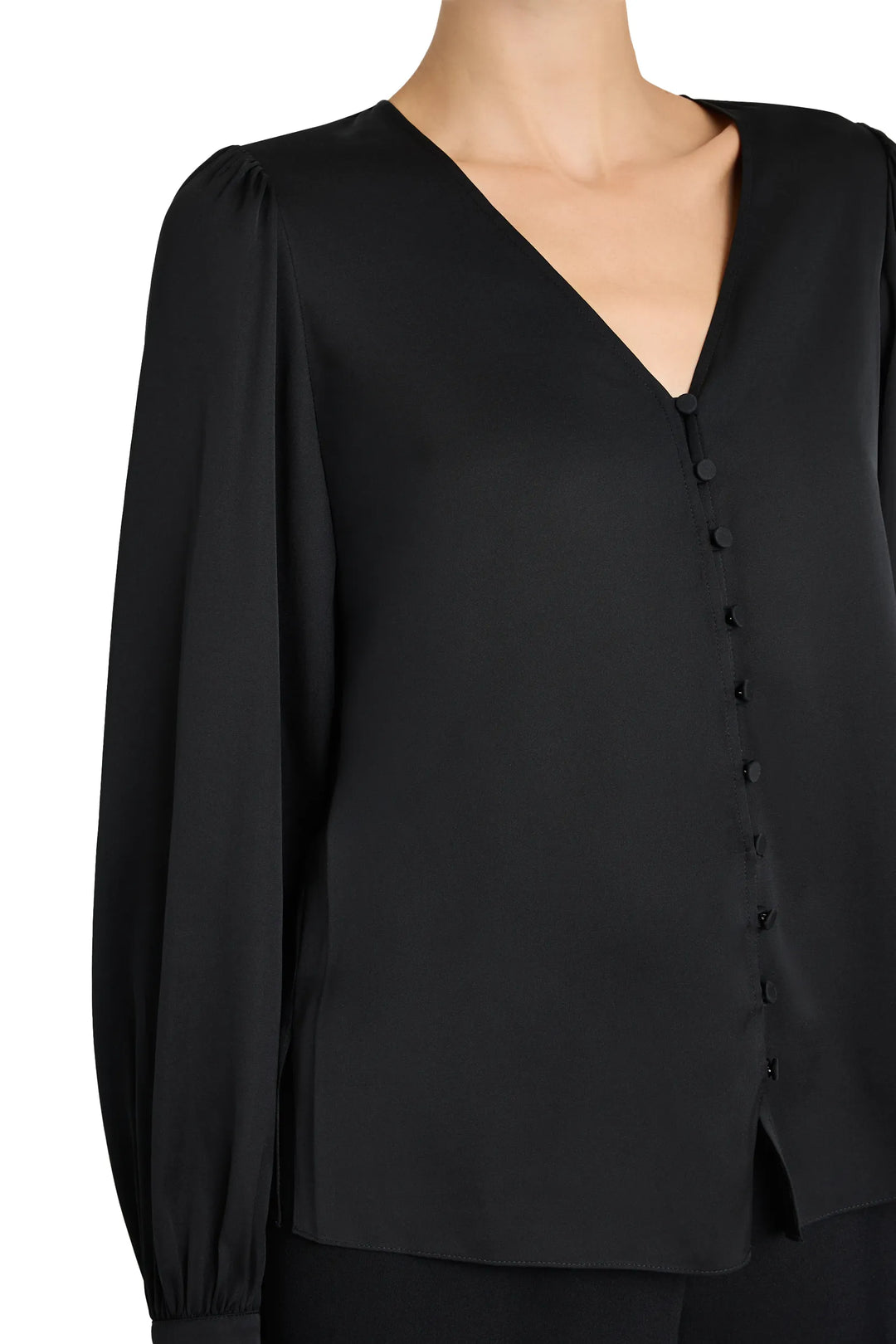 V-neck button down blouse with layered tailoring, front buttons, hip length silhouette; front view on model.