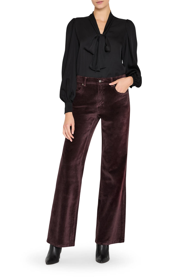 Selena Blouse with romantic silhouette, black tie neck, pintucked front, bishop sleeves; front view on model.