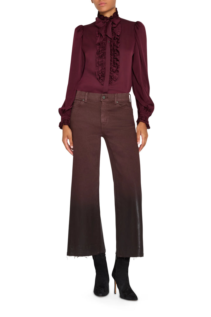 Silk ruffle blouse with draped silhouette and gathered details at neckline, front view on model.