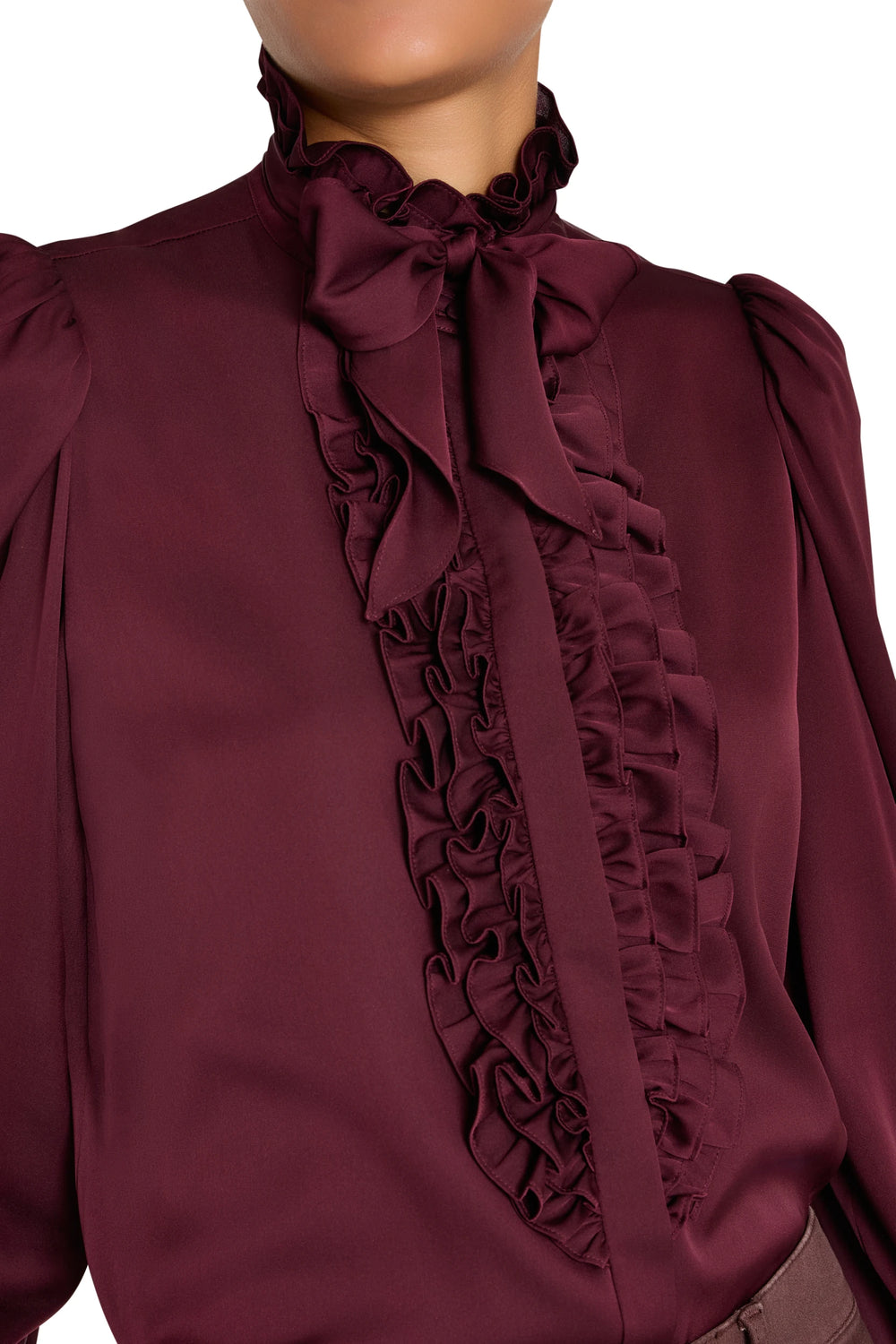 Silk blouse with ruffles, handkerchief neck tie, cropped shoulders and fluid silhouette. Front view on model.