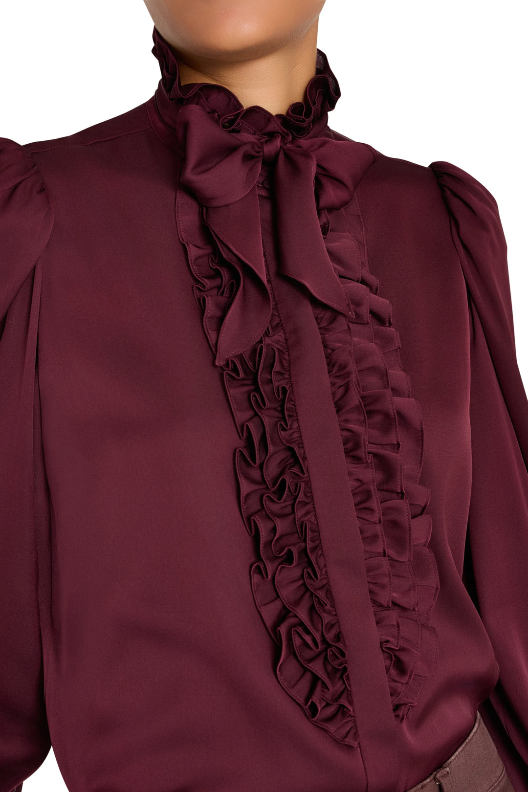 Silk blouse with ruffles, handkerchief neck tie, cropped shoulders and fluid silhouette. Front view on model.