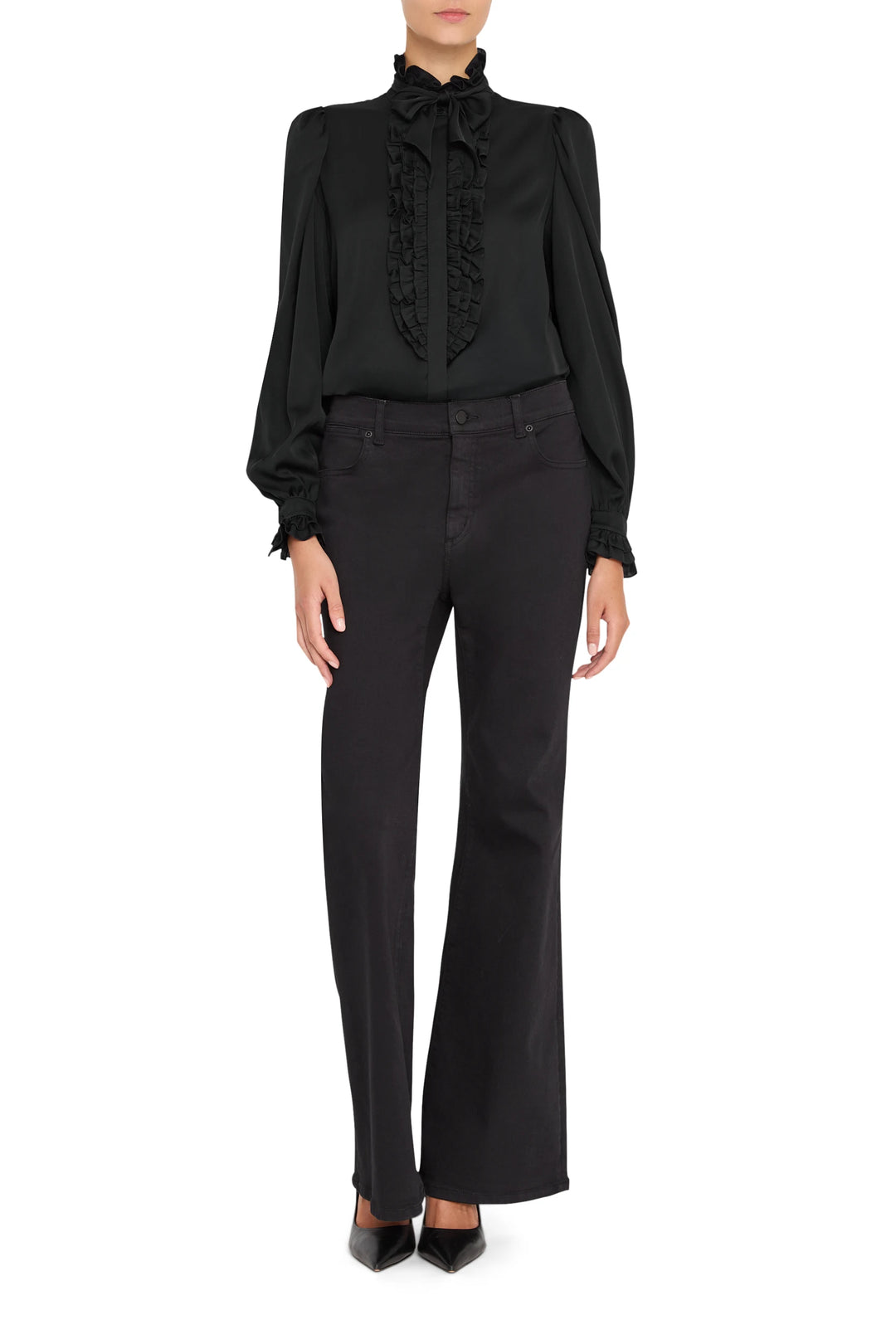 Silk blouse with ruffle front, high collar, and button placket. Voluminous sleeves. Front view on model.