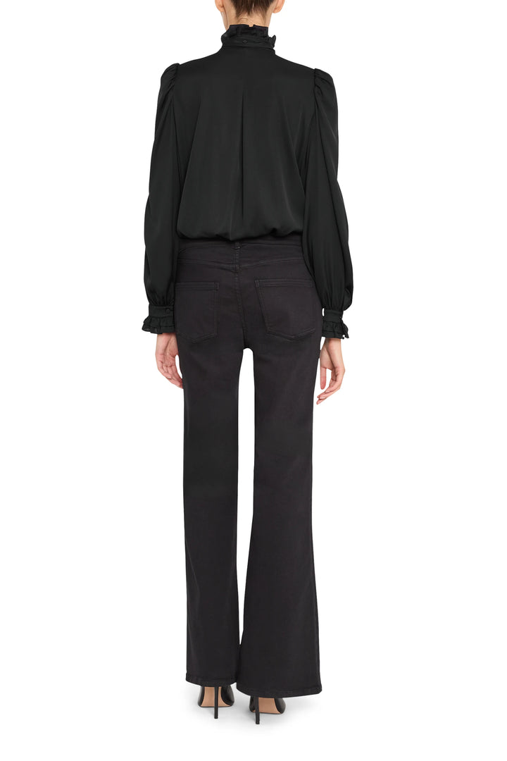 Silk ruffle blouse with long sleeves, relaxed silhouette, ruffle detail at back yoke; back view on model.