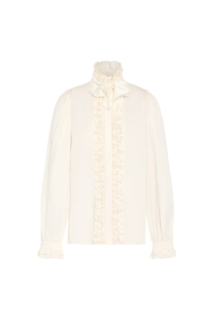 Silk blouse with long sleeves, high ruffled collar, and bow tie neck. Tailored silhouette. Front view on white.