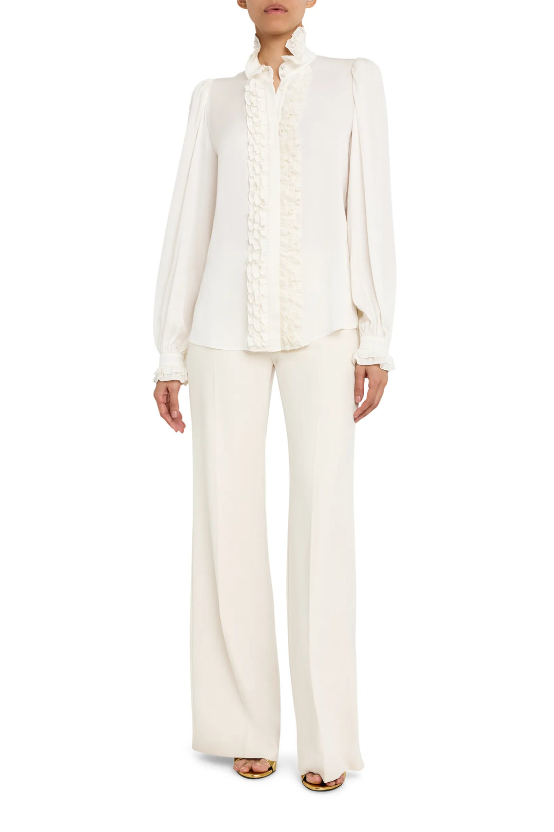 Long-sleeve silk blouse with ruffle detail and relaxed silhouette, front view on model.