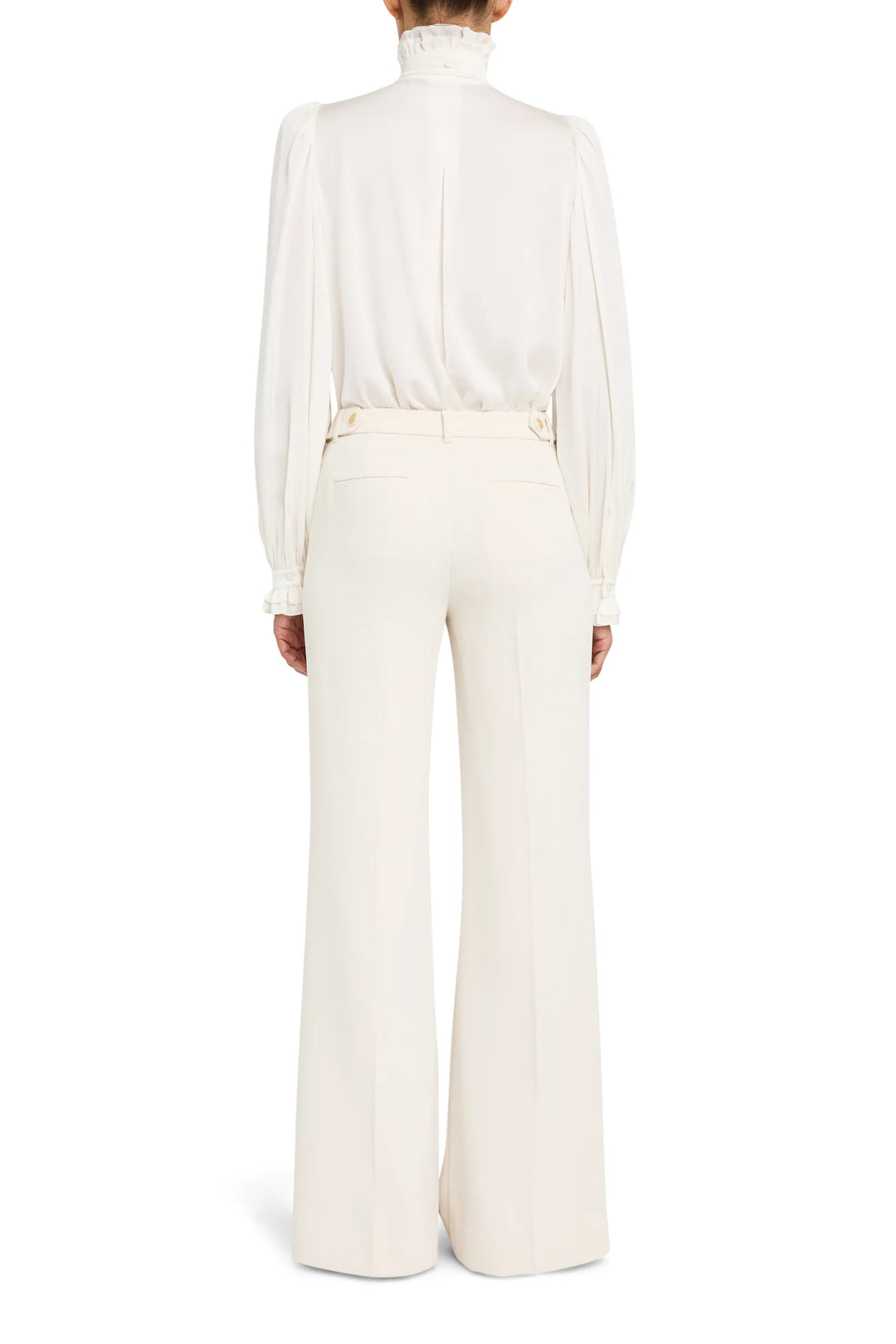 Silk blouse with ruffled detailing and relaxed silhouette, back view on model.
