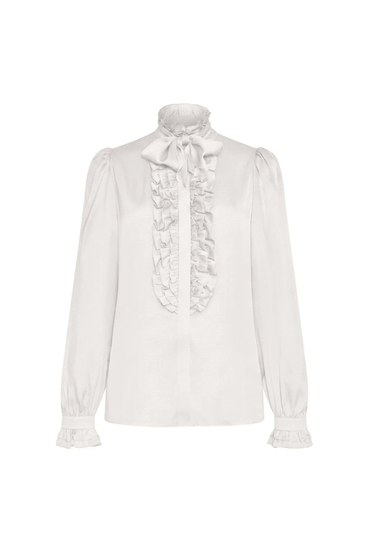 Silk blouse with ruffled high neck, bow tie, buttoned cuffs, and long sleeves. Front view on white.