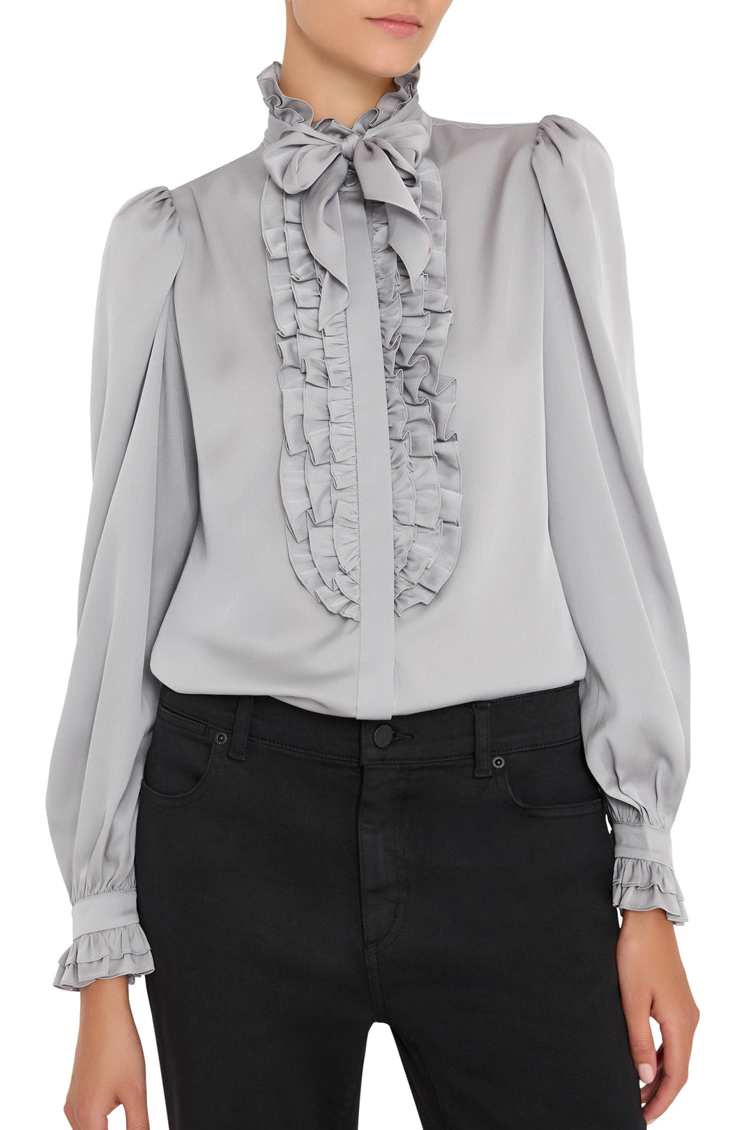 Silk blouse with ruffle trim, bow tie neck, relaxed fit, long sleeves. Front view on model.