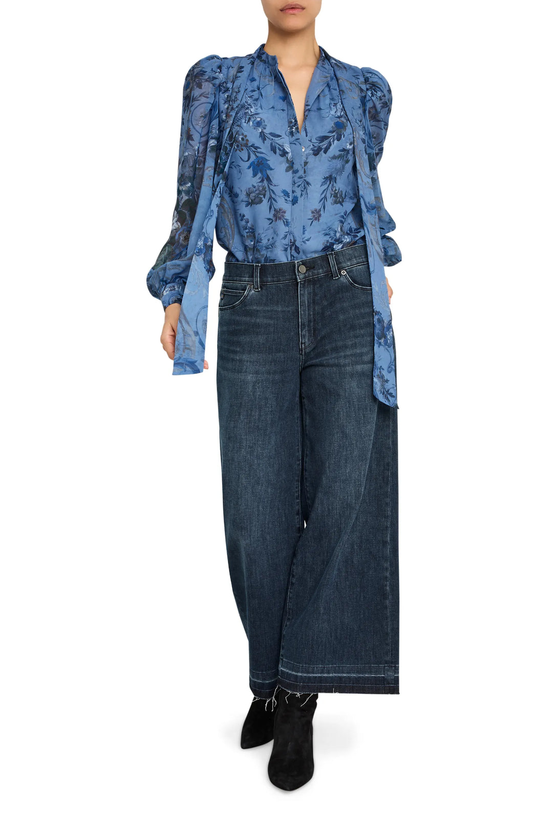 Sheer blouse with blue print, relaxed silhouette, lightweight fabric, button front; front view on model.