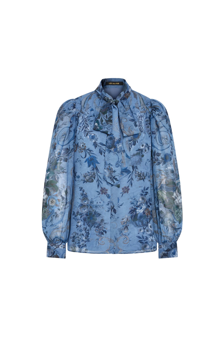 Silk blouse with tie-neck, puffed long sleeves, blue floral print, relaxed fit. Front view on white.