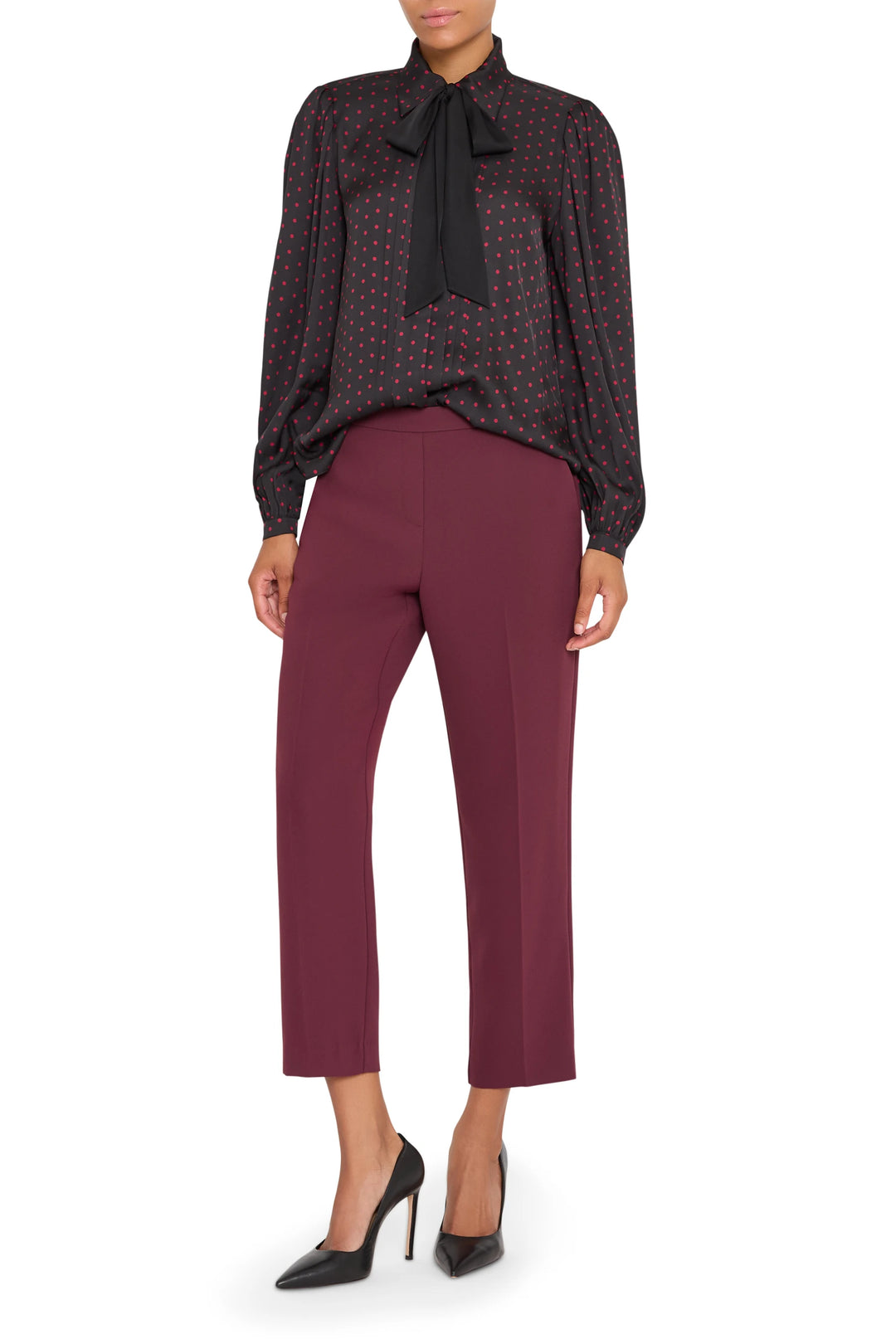 Silk blouse with polka dot pattern, relaxed fit, long sleeves, button front; front view on model.