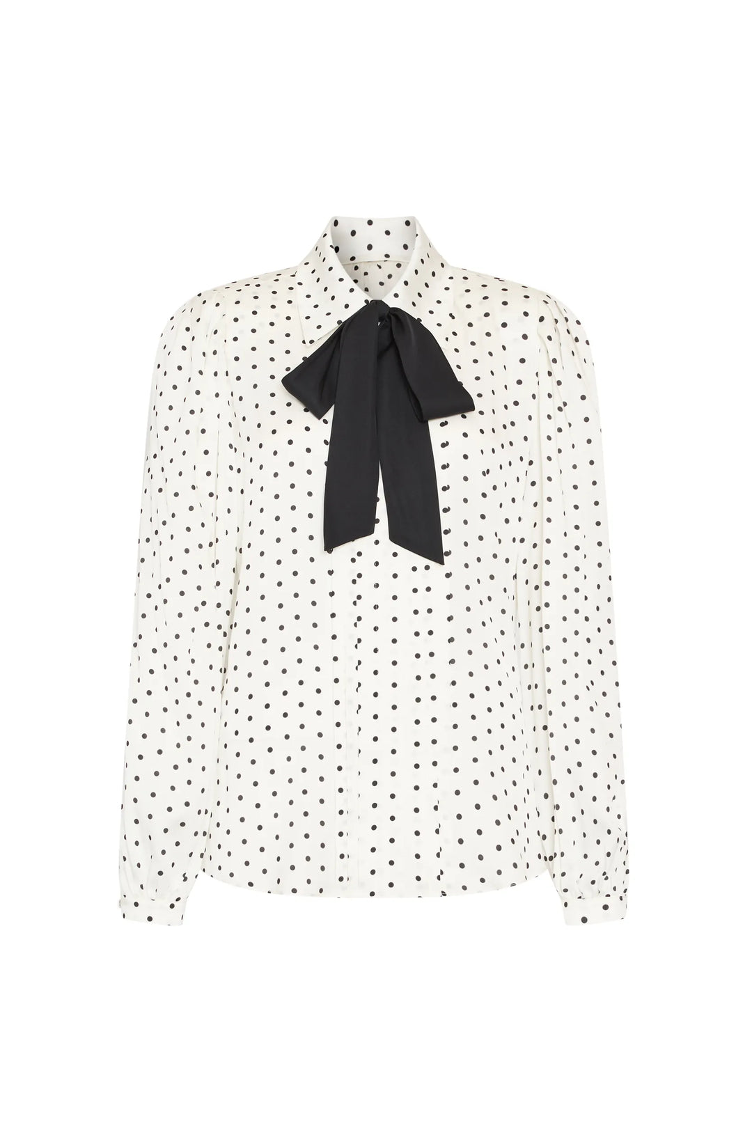 Silk blouse with long sleeves, buttoned cuffs, polka dots, oversized bow at collar; front view on white.