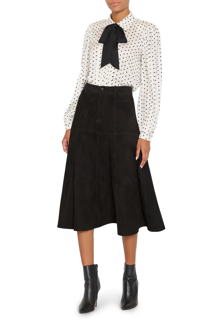 Relaxed-fit silk blouse with polka dot print, removable tie at collar, button front. Front view on model.