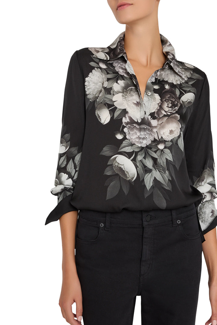 Straight-cut silk blouse with printed pattern, collar, and button front; long sleeves; front view on model.