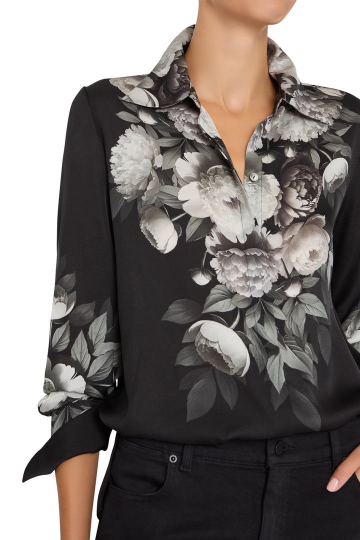 Silk blouse with botanical print, relaxed fit, rolled sleeves, button front, fluid silhouette; front view on model.