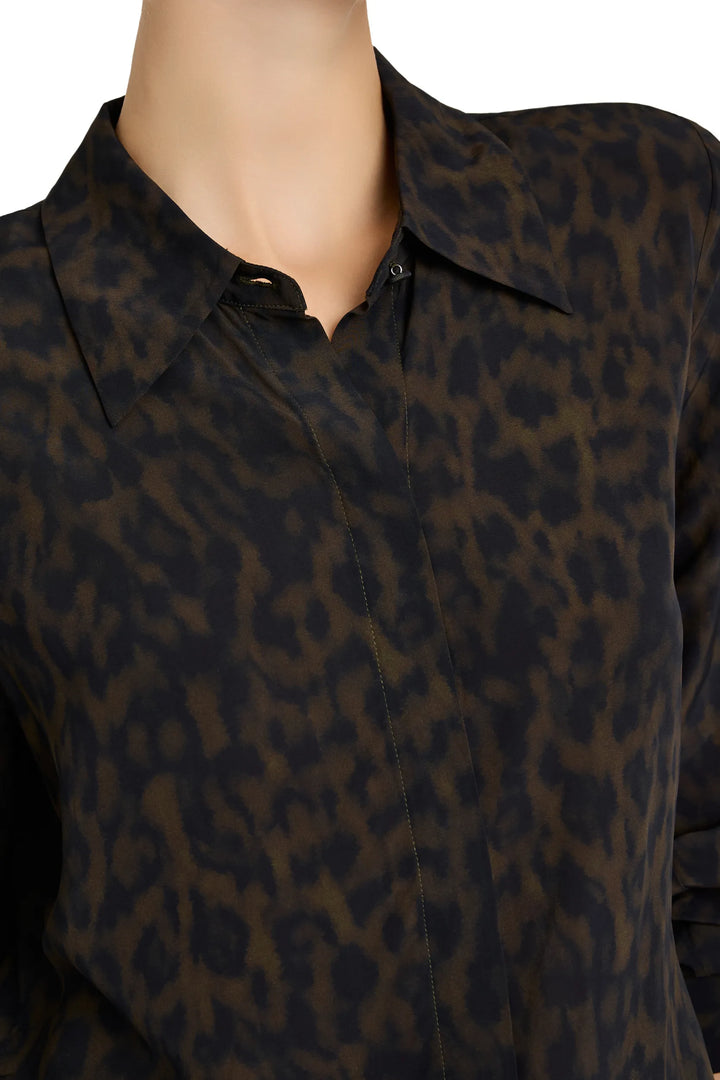 Abstract animal-print blouse with relaxed silhouette, long sleeves, fluid fabric; detail view.