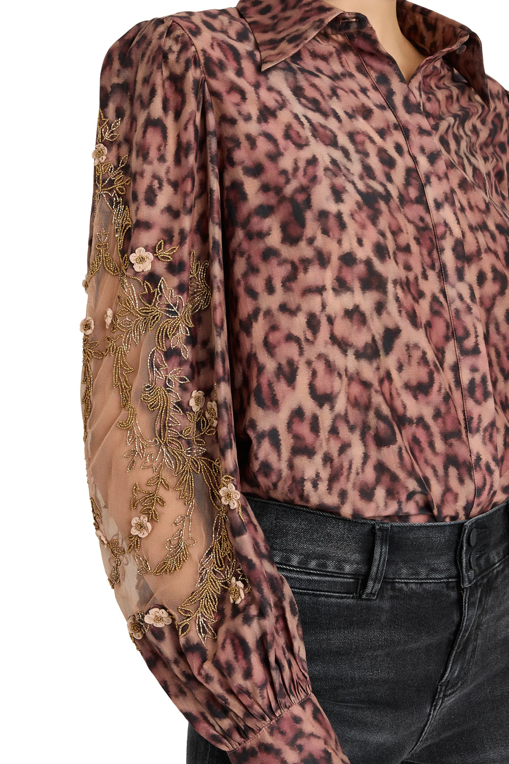 Relaxed-fit blouse with artisan bishop sleeves, fluid silhouette, leopard print crepe. Front view on model.