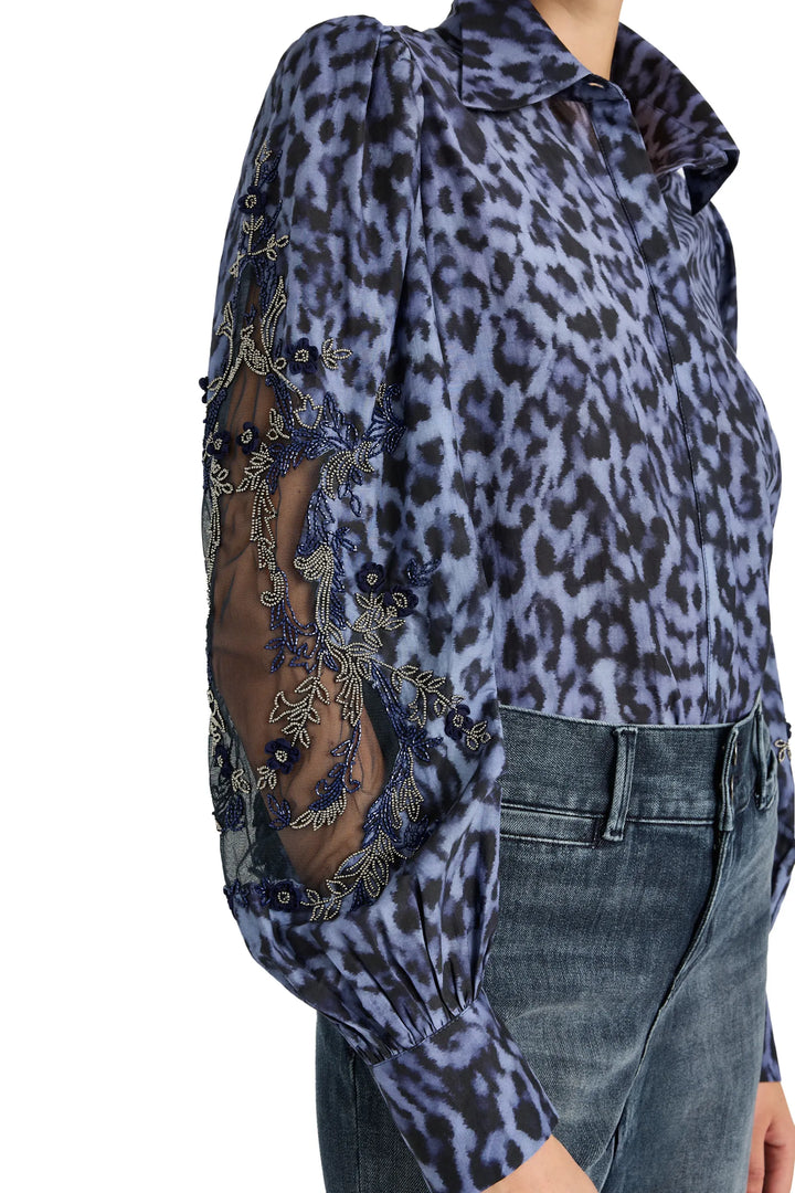 Relaxed-fit blouse with artisan sleeve details and printed fabric, button front; front view on white.