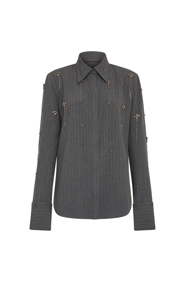 Relaxed-fit shirt in dark gray pinstripe with crystal embellishment, structured collar, wide cuffs; front view on white.