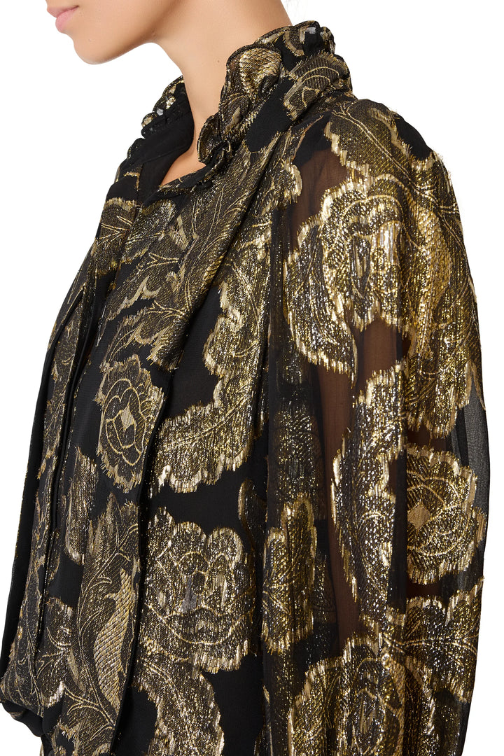 Niosha Lurex Jacquard Blouse with ruffled collar and puffed sleeves, side view on model.