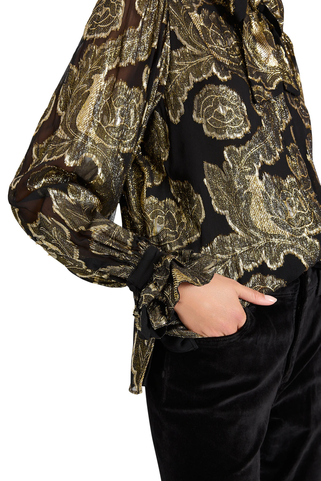 Niosha Lurex Jacquard Blouse with metallic floral pattern and ruffled cuffs, side view on model.