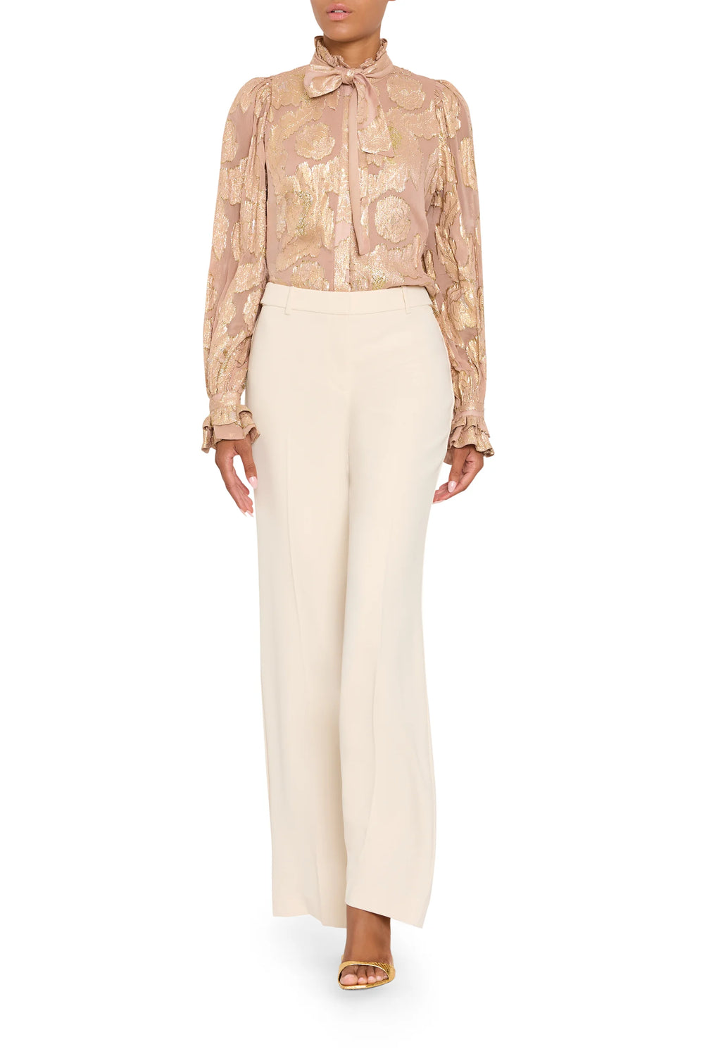 Niosha Lurex Jacquard blouse with puffed sleeves, high ruffled neck, tie-neck, and ruffled cuffs, front view on model.