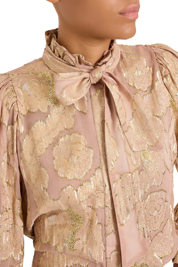 Niosha Lurex Jacquard blouse with puffed shoulders, ruffled collar, and tie-neck, front view on model.