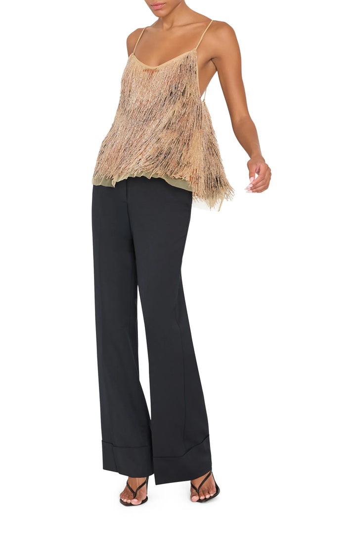 Sleeveless blouse with relaxed silhouette, embellished details, lightweight fabric; front view on white.