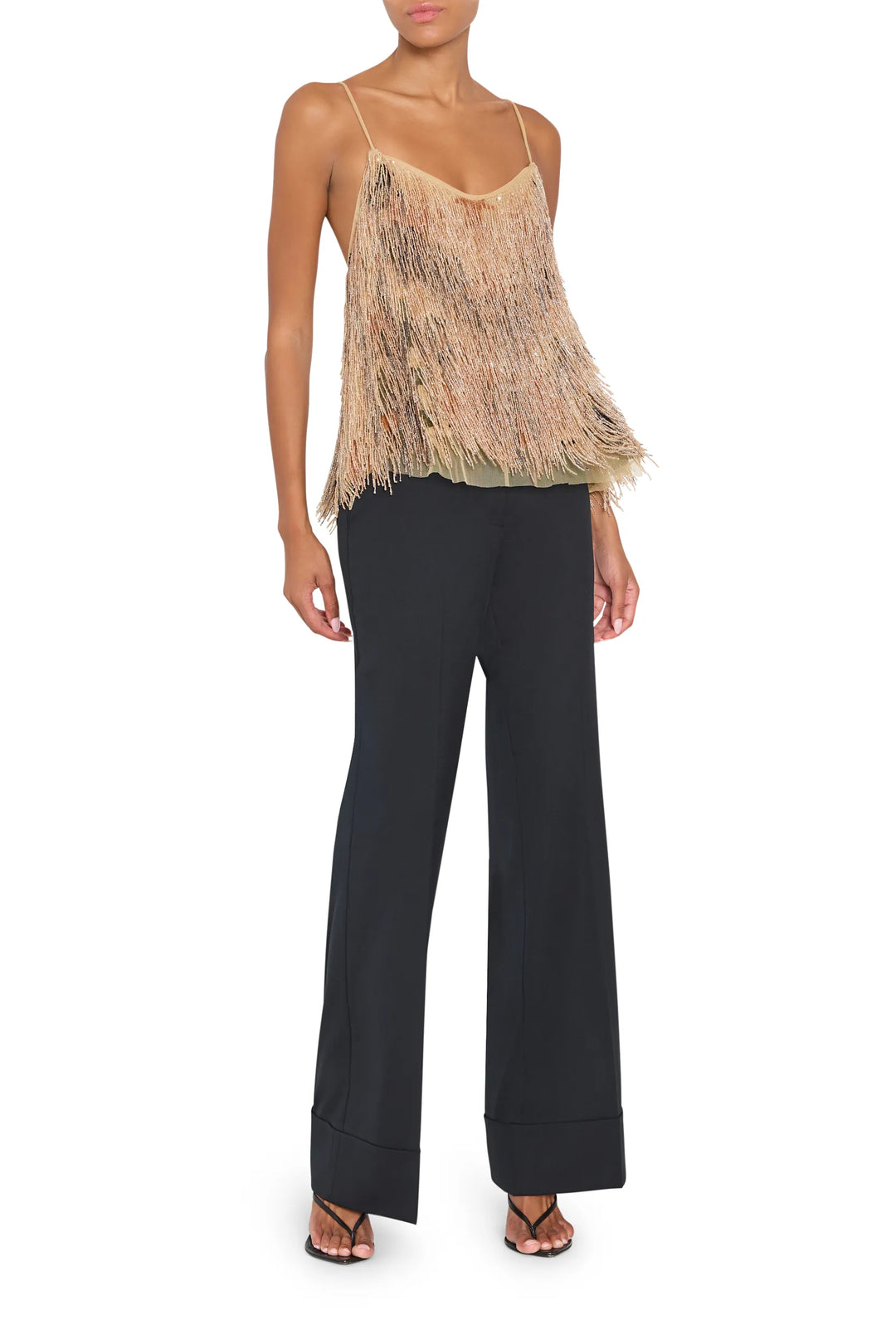 Sleeveless blouse with fluid silhouette, embellished details, lightweight fabric; front view on white.