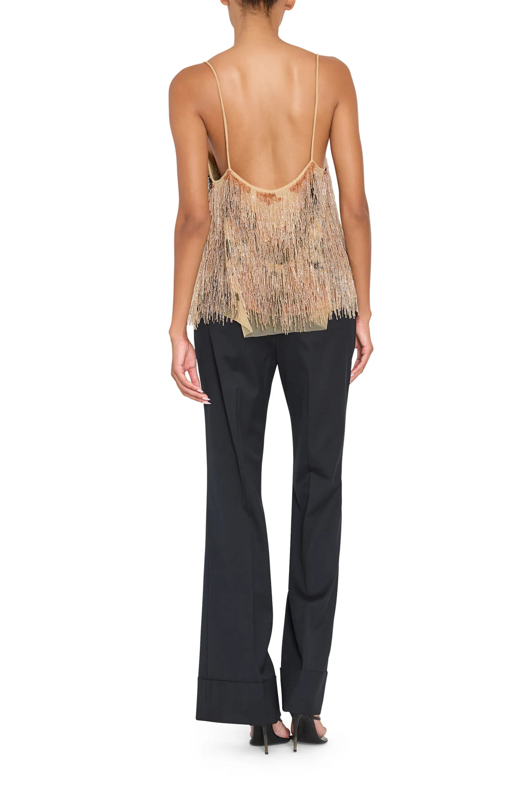 Sleeveless blouse with spaghetti straps, embellished details, fluid fit; back view on model.