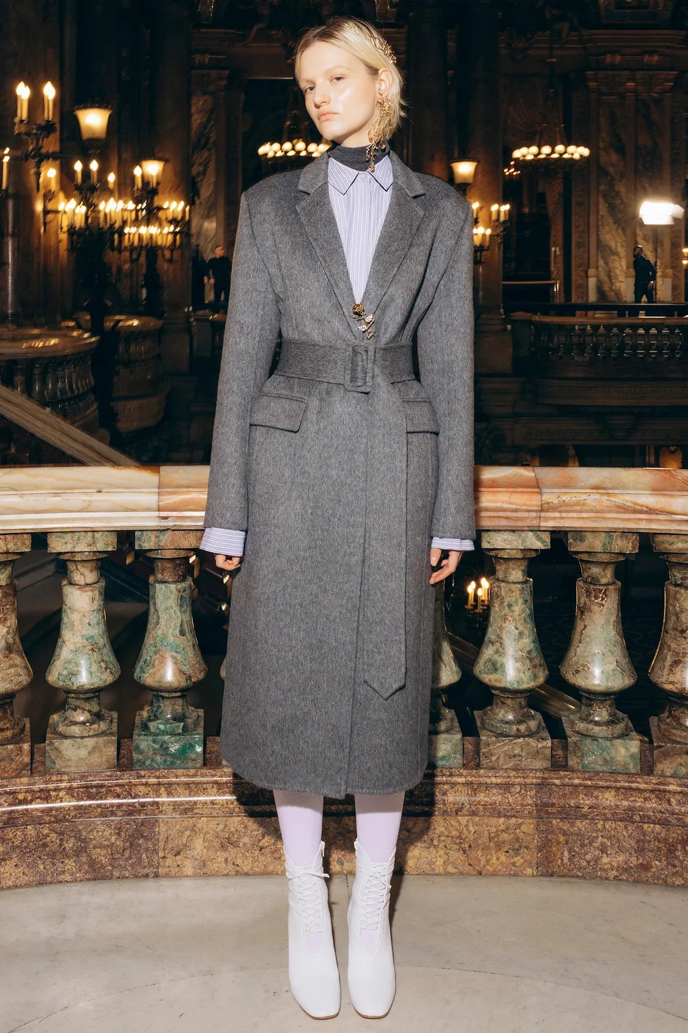 Long wool silk coat with belted waist, structured silhouette, notched lapels. Front view on model.