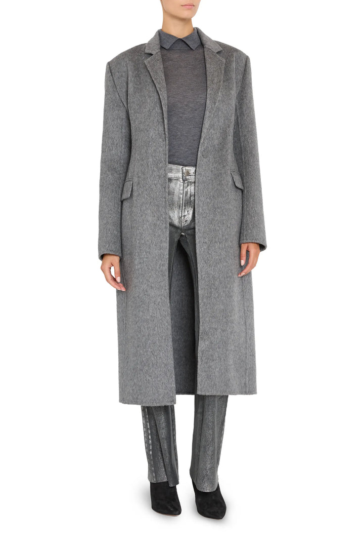 Long belted coat in wool silk with tailored silhouette, notch lapels, and clean lines; front view on white.
