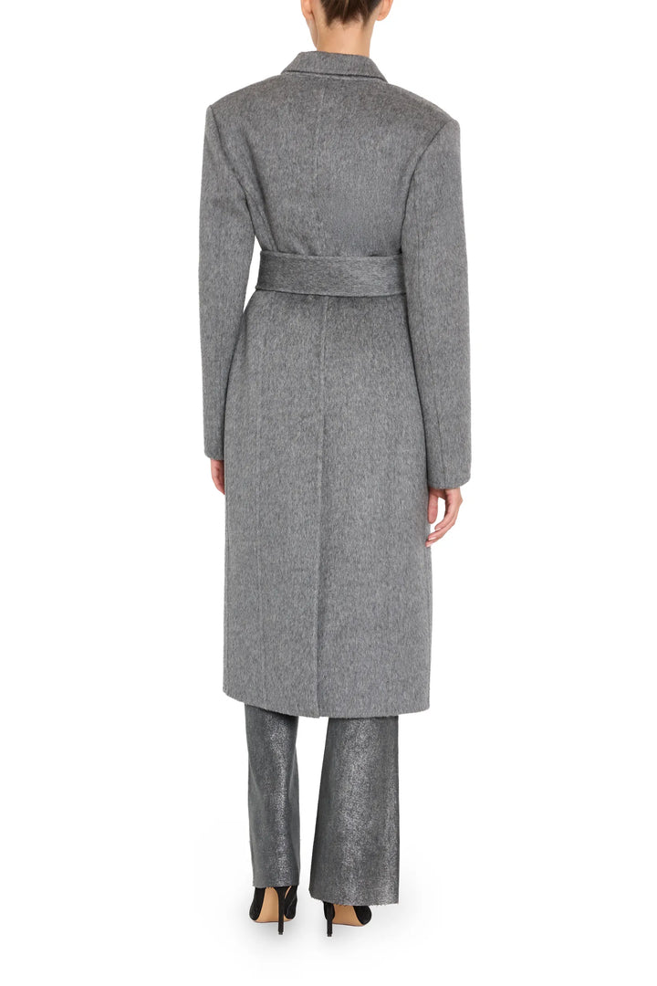 Long belted coat in wool silk with couture tailoring, draped silhouette and clean lines, back view on model.