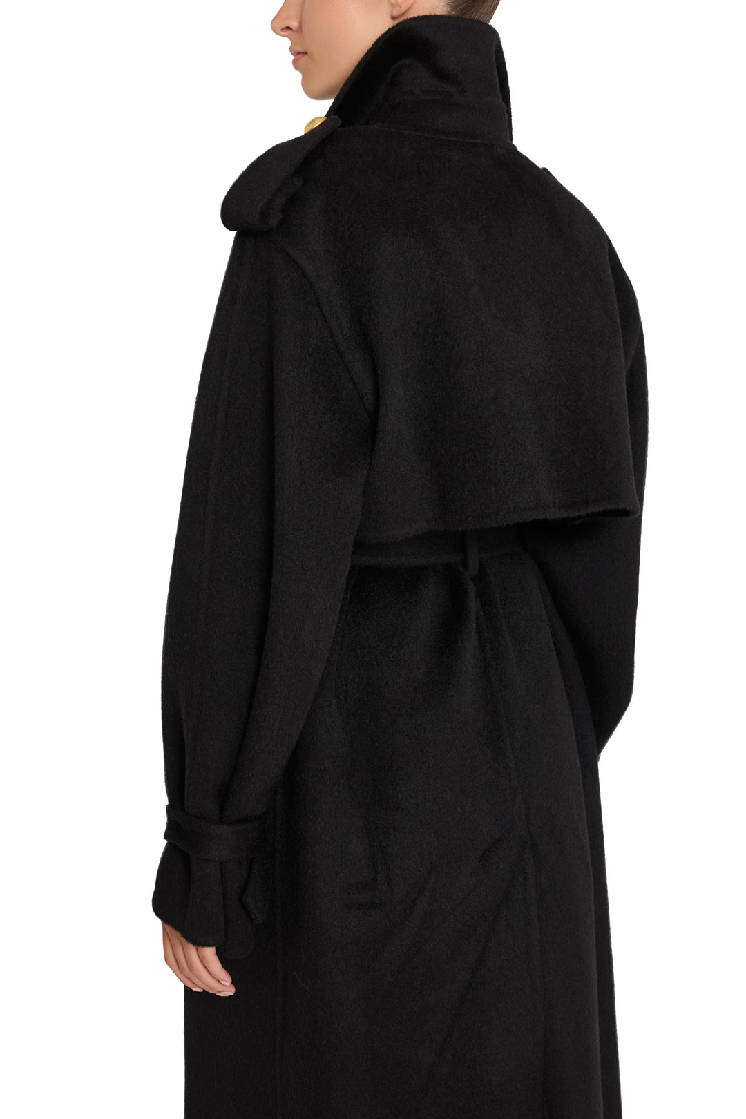 Long, tailored trench coat with high collar in silk wool; clean lines and structured silhouette; back view on model.