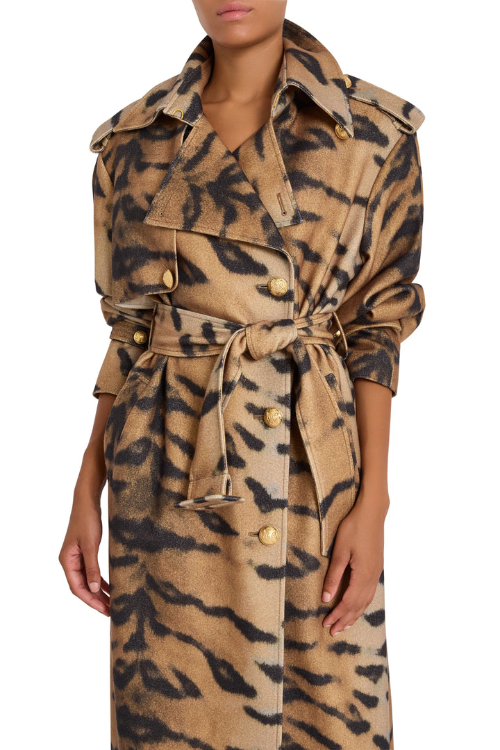 Double-breasted animal printed coat with gold buttons, belted waist; structured silhouette, front view on model.