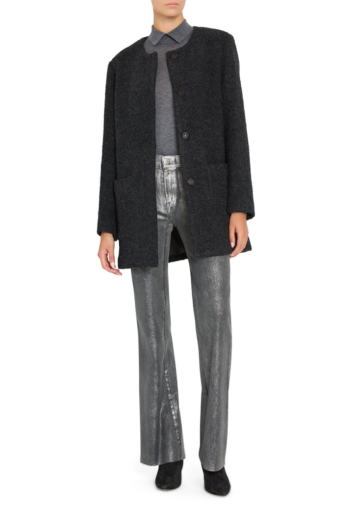 Long, tailored bouclé coat with attached scarf, structured shoulders, and open front; front view on model.