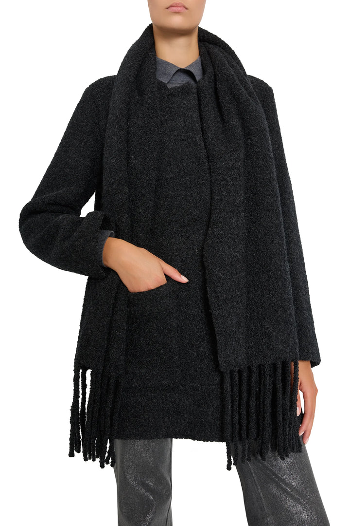 Longline bouclé coat with tailored collar, front buttons, and textured finish; front view on model.