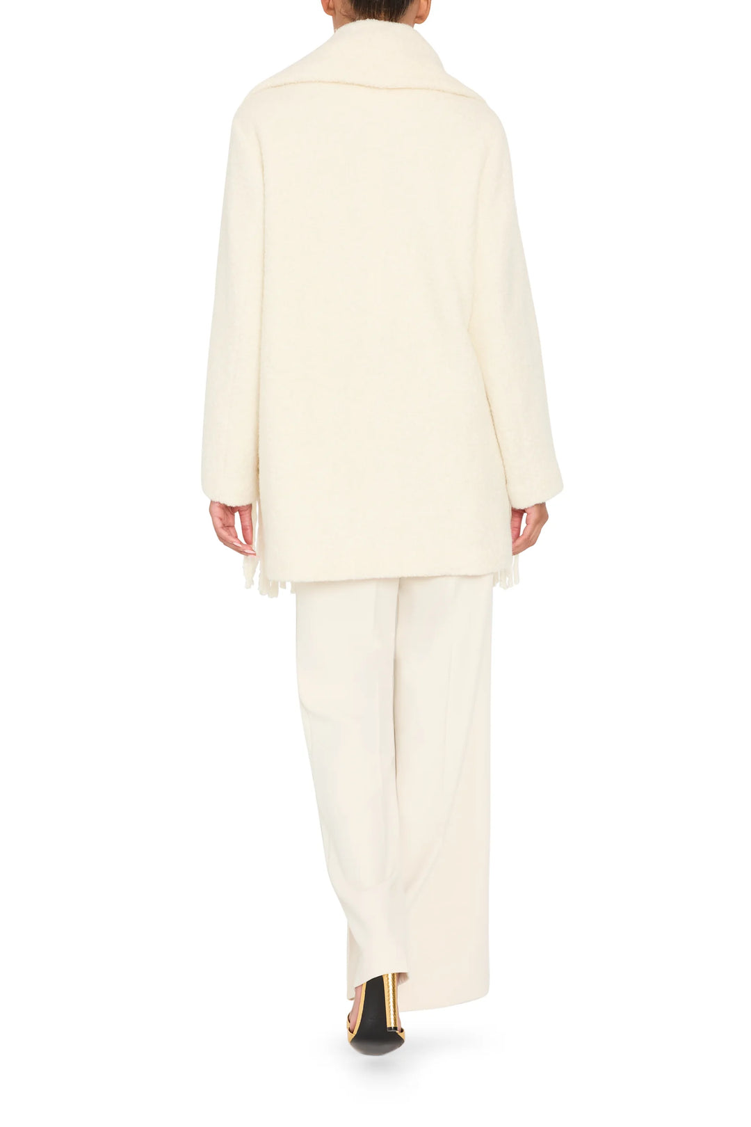 Longline bouclé coat with attached scarf, tailored silhouette and button front. Front view on model.